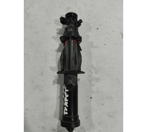 Форсунка омывателя фары левая