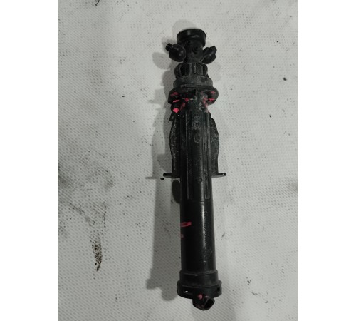 Форсунка омывателя фары левая