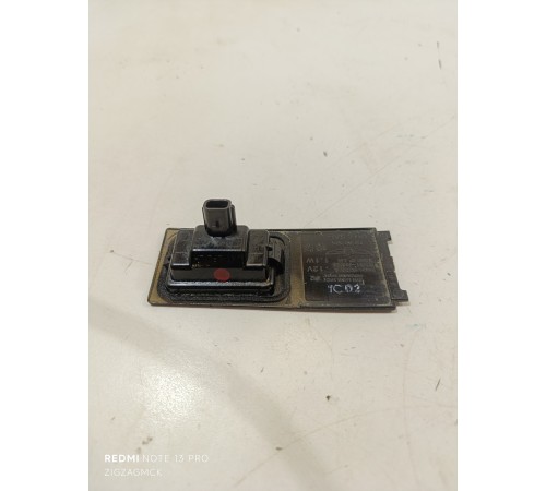 Фонарь подсветки номера левый