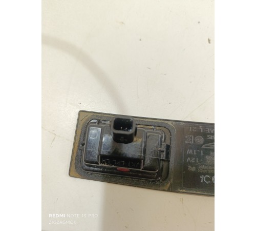 Фонарь подсветки номера левый