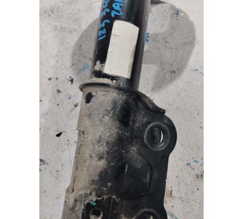 Стойка амортизатора передняя левая
