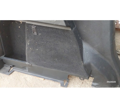 Обшивка багажника левая