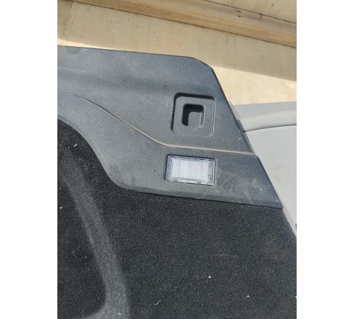 Обшивка багажника левая