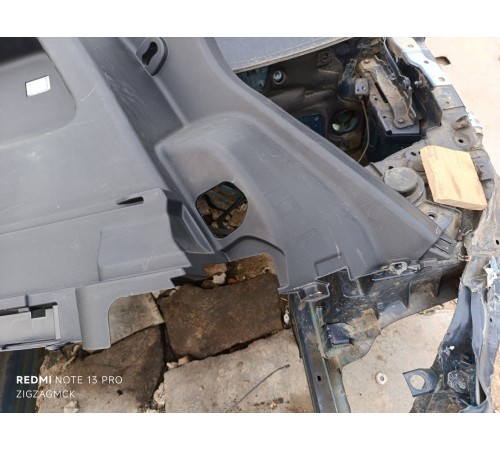 Обшивка багажника левая