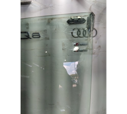 Стекло двери переднее левое