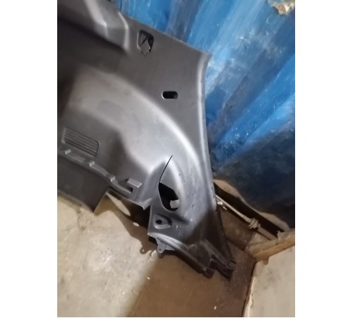 Обшивка багажника левая