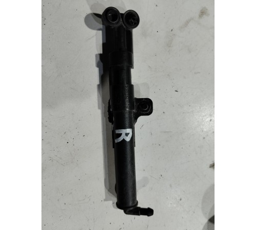 Форсунка омывателя фары правая