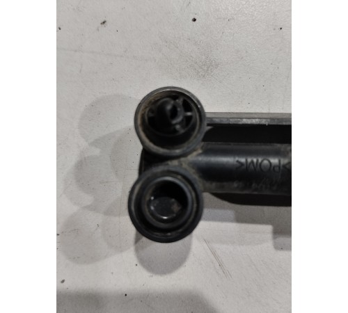 Форсунка омывателя фары правая