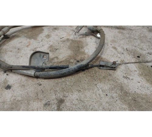 Трос стояночного тормоза левый