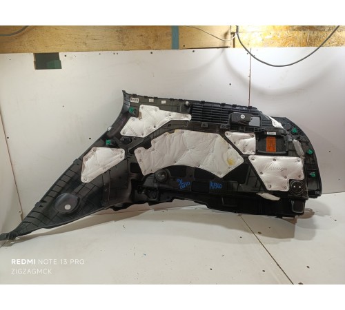 Обшивка багажника левая