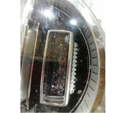 Фара головного света левая