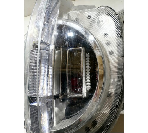 Фара головного света левая