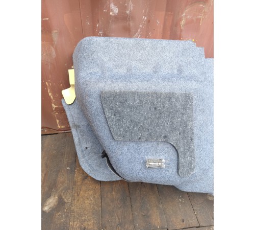 Обшивка багажника левая