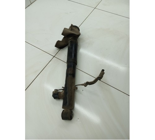 Амортизатор задний левый