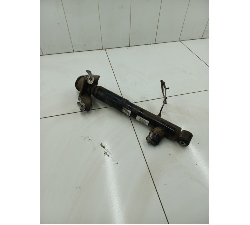 Амортизатор задний левый